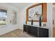 Stylish entryway with a decorative console table and modern artwork at 15104 Blue Bay Ter, Lakewood Ranch, FL 34211