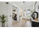 Inviting foyer with sliding barn doors, tile flooring, and decorative accents at 15104 Blue Bay Ter, Lakewood Ranch, FL 34211