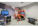 Well-equipped game room with arcade machines and comfortable seating, perfect for entertainment at 15104 Blue Bay Ter, Lakewood Ranch, FL 34211