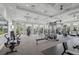 Spacious gym featuring modern exercise equipment, ceiling fans, and large windows showcasing views of the property at 15104 Blue Bay Ter, Lakewood Ranch, FL 34211