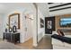 Stylish hallway featuring a sliding barn door, modern artwork, and wood-look tile flooring at 15104 Blue Bay Ter, Lakewood Ranch, FL 34211