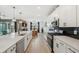 Modern kitchen with a large island, stainless steel appliances, and wooden floors at 15104 Blue Bay Ter, Lakewood Ranch, FL 34211