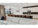 Modern kitchen with a white island, pendant lighting, and stainless steel appliances at 15104 Blue Bay Ter, Lakewood Ranch, FL 34211