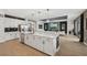 Contemporary kitchen featuring a large island, stainless steel appliances, and open to the living area at 15104 Blue Bay Ter, Lakewood Ranch, FL 34211