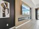 Modern living room featuring a linear fireplace, accent wall, and designer artwork at 15104 Blue Bay Ter, Lakewood Ranch, FL 34211