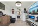 Modern office with a leather chair, wooden cabinet, and decorative wall art at 15104 Blue Bay Ter, Lakewood Ranch, FL 34211
