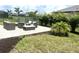 Stone patio featuring outdoor seating and lush tropical landscaping at 15104 Blue Bay Ter, Lakewood Ranch, FL 34211