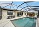 The backyard features a private pool, covered patio with bar, and ample seating for entertaining at 15104 Blue Bay Ter, Lakewood Ranch, FL 34211