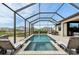 Inviting screened-in pool and spa surrounded by pavers at 15104 Blue Bay Ter, Lakewood Ranch, FL 34211
