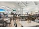 Bright and airy restaurant with tables and chairs with view of the community center at 15104 Blue Bay Ter, Lakewood Ranch, FL 34211