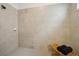 Tiled walk-in shower offers a built-in bench, modern showerhead, and ample space at 15104 Blue Bay Ter, Lakewood Ranch, FL 34211