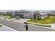 Street view of modern homes with well-maintained lawns and tree-lined streets in a suburban neighborhood at 15104 Blue Bay Ter, Lakewood Ranch, FL 34211