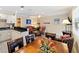 Cozy living room and kitchen featuring modern decor, including granite counters, updated cabinets, and stylish furnishings at 1603 Gulf Dr N # 6, Bradenton Beach, FL 34217