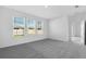 Comfortable bedroom with plush carpeting and ample natural light from the three windows at 16097 Old Fox Trl, Port Charlotte, FL 33953