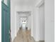 Bright entryway featuring wood-look tiling and access to multiple rooms at 16097 Old Fox Trl, Port Charlotte, FL 33953