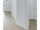 Bright entryway featuring wood-look tiling, a white door, and clean lines at 16097 Old Fox Trl, Port Charlotte, FL 33953