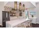 Clubhouse kitchen featuring modern stainless steel appliances, a long island, and stylish decor at 16097 Old Fox Trl, Port Charlotte, FL 33953