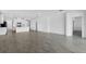 Open-concept living space featuring tile flooring, a modern kitchen, and seamless transition to other areas at 16097 Old Fox Trl, Port Charlotte, FL 33953