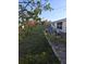 Landscaped backyard featuring a brick patio with outdoor furniture for entertaining guests at 1750 Gold Ave, Sarasota, FL 34235