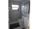 Inviting bathroom with a glass-enclosed shower, modern fixtures, and chic decor at 1750 Gold Ave, Sarasota, FL 34235