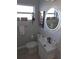 Well-lit bathroom with a modern sink and decorative mirror at 1750 Gold Ave, Sarasota, FL 34235