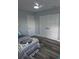 Bright bedroom featuring wood-look floors and a convenient double-door closet at 1750 Gold Ave, Sarasota, FL 34235