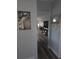Hallway view showcasing wood-look flooring, stylish decor, and inviting living space at 1750 Gold Ave, Sarasota, FL 34235