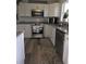 Well-appointed kitchen featuring granite countertops and stainless steel appliances at 1750 Gold Ave, Sarasota, FL 34235