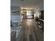 Open-concept living area with bar seating, modern furniture, and stylish decor at 1750 Gold Ave, Sarasota, FL 34235