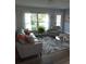 Living room featuring a sofa, chair, and decorative fern at 1750 Gold Ave, Sarasota, FL 34235