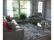 Cozy living room with a modern rug, comfortable seating, and stylish accents at 1750 Gold Ave, Sarasota, FL 34235