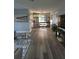 Spacious open-concept living area with modern appliances and hardwood floors at 1750 Gold Ave, Sarasota, FL 34235