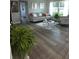 Bright living room with a comfortable sofa, stylish decor, and lots of natural light at 1750 Gold Ave, Sarasota, FL 34235