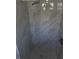 Modern shower featuring a rainfall showerhead and elegant gray marble-look tile walls at 1750 Gold Ave, Sarasota, FL 34235