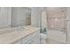 Bathroom featuring a bathtub with shower, quartz countertop, and a toilet at 17714 Northwood Pl, Bradenton, FL 34202