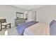 Comfortable bedroom featuring neutral walls, dresser with mirror, and a stylish chair at 17714 Northwood Pl, Bradenton, FL 34202