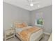 Cozy bedroom showcasing a queen bed with a window view and light-toned furnishings at 17714 Northwood Pl, Bradenton, FL 34202