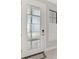 Stylish front door with frosted glass panels, paired with a sidelight for added brightness and privacy at 17714 Northwood Pl, Bradenton, FL 34202