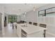 Open kitchen with a large island, stainless steel appliances, and an adjacent dining area at 17714 Northwood Pl, Bradenton, FL 34202