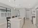 Bright kitchen with white cabinets, stainless steel appliances, and a view of the shuttered window at 17714 Northwood Pl, Bradenton, FL 34202