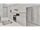 Chic kitchen featuring stainless steel appliances, white cabinets, and stylish backsplash at 17714 Northwood Pl, Bradenton, FL 34202
