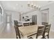 Modern kitchen and dining area with stainless steel appliances and light colored cabinetry at 17714 Northwood Pl, Bradenton, FL 34202