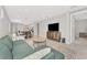 Inviting open-concept living area with stylish decor and easy access to other rooms in the house at 17714 Northwood Pl, Bradenton, FL 34202
