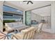 Covered brick patio featuring a seating area with a sofa and sliding glass doors leading inside at 17714 Northwood Pl, Bradenton, FL 34202