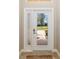 Elegant front door with glass panels offers a glimpse of the exterior, enhancing curb appeal and natural light at 182 Bella Vista Ter # 23A, Nokomis, FL 34275