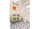 Updated bathroom with modern vanity, glass door, designer floor tiles, and efficient toilet at 1829 Cypress Point Ln, Sarasota, FL 34234