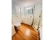 Charming bathroom featuring a vanity with storage, a toilet, and a glass door walk-in shower at 1829 Cypress Point Ln, Sarasota, FL 34234