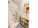 Updated bathroom features a modern vanity, designer floor tiles, and a tub-shower at 1829 Cypress Point Ln, Sarasota, FL 34234