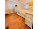 Charming bedroom featuring hardwood floors, white furniture, and shuttered windows at 1829 Cypress Point Ln, Sarasota, FL 34234