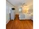 Comfortable bedroom with hardwood floors, neutral walls, and shuttered windows at 1829 Cypress Point Ln, Sarasota, FL 34234
